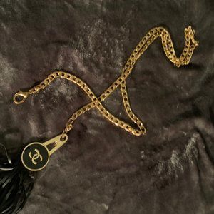 Chanel style belt gold with black tassle